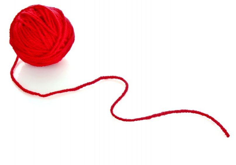 8641006 - red ball of woollen red thread isolated on white